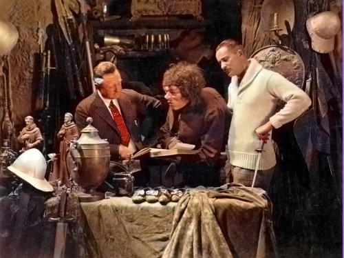 On the set of The Hunchback of Notre Dame (1923). From left to right: Wallace Worsley (director), Lon Chaney ("Quasimodo"), and Norman Kerry ("Phoebus"). Photo colorized by Robert M. Fells.